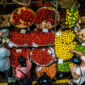people buying food, fruit and vegetables at a stall in traditional central market in Port Louis, Mauritius | ROOTSMRU LTD